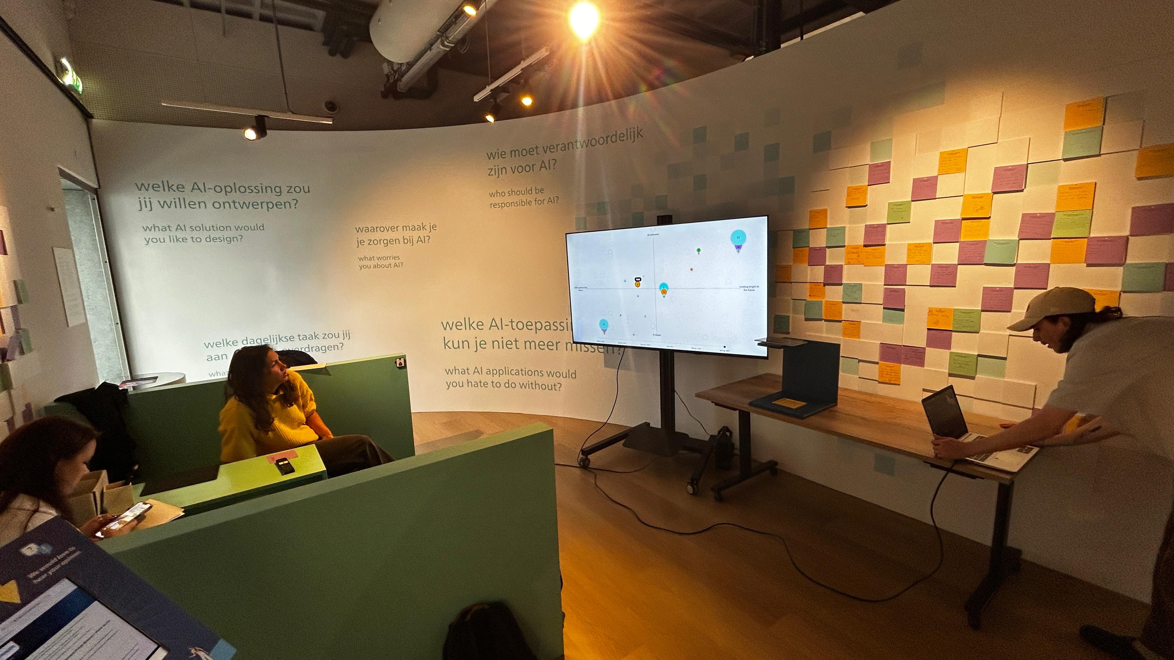 Visitors and team members viewing the live PostWall visualization