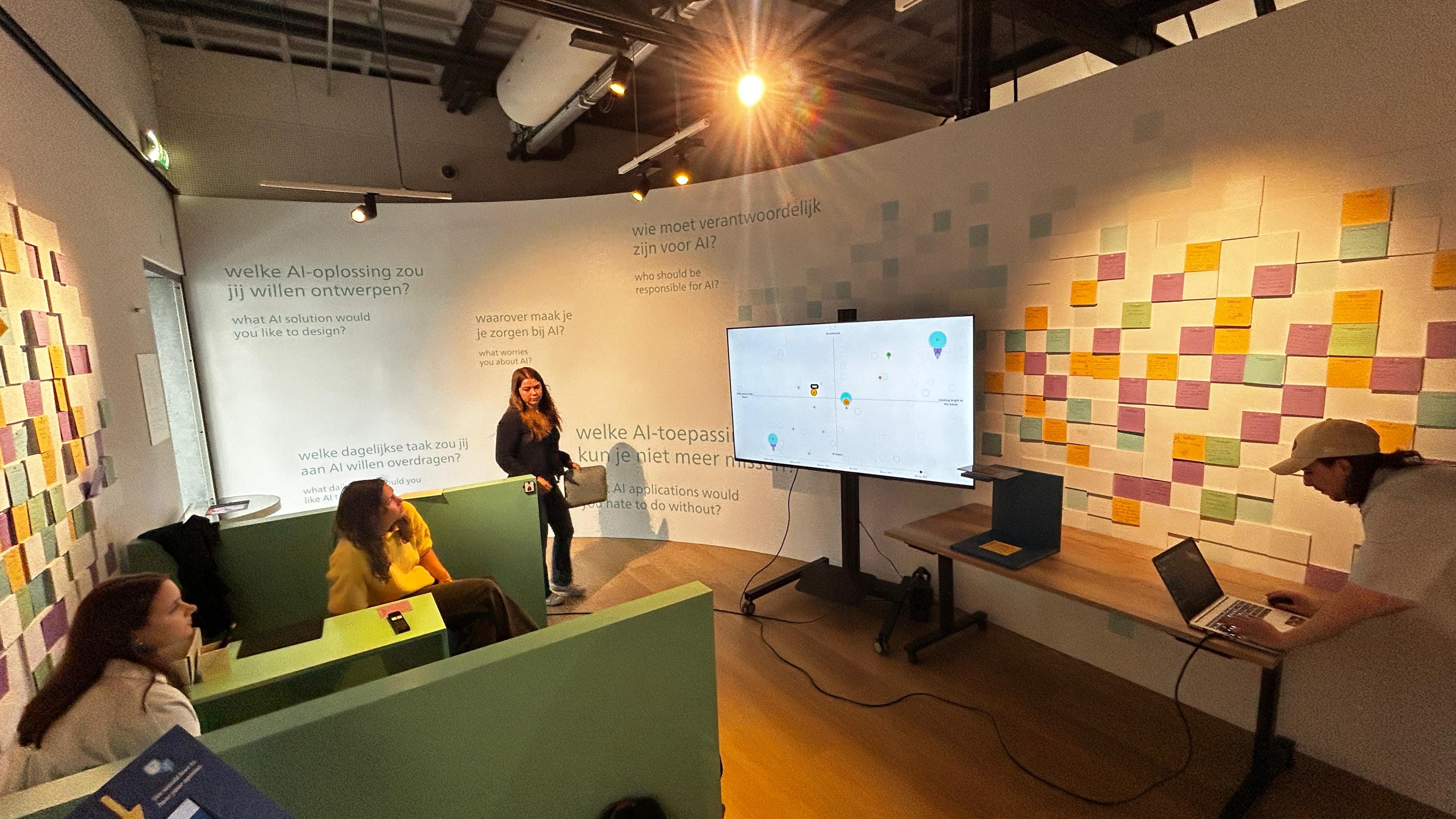 Event table with the PostWall installation and two display screens