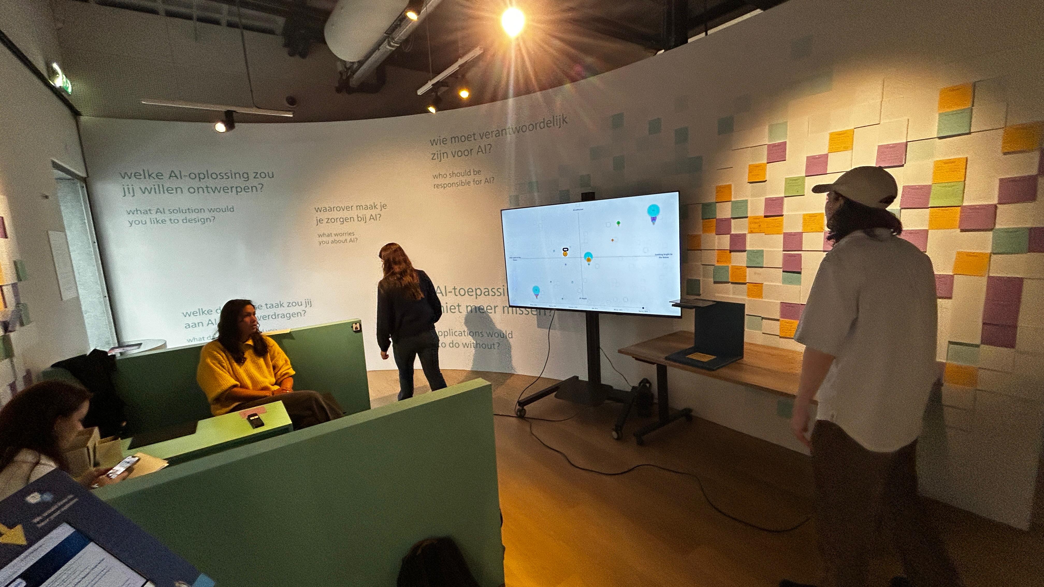 Visitors testing the PostWall experience at the event